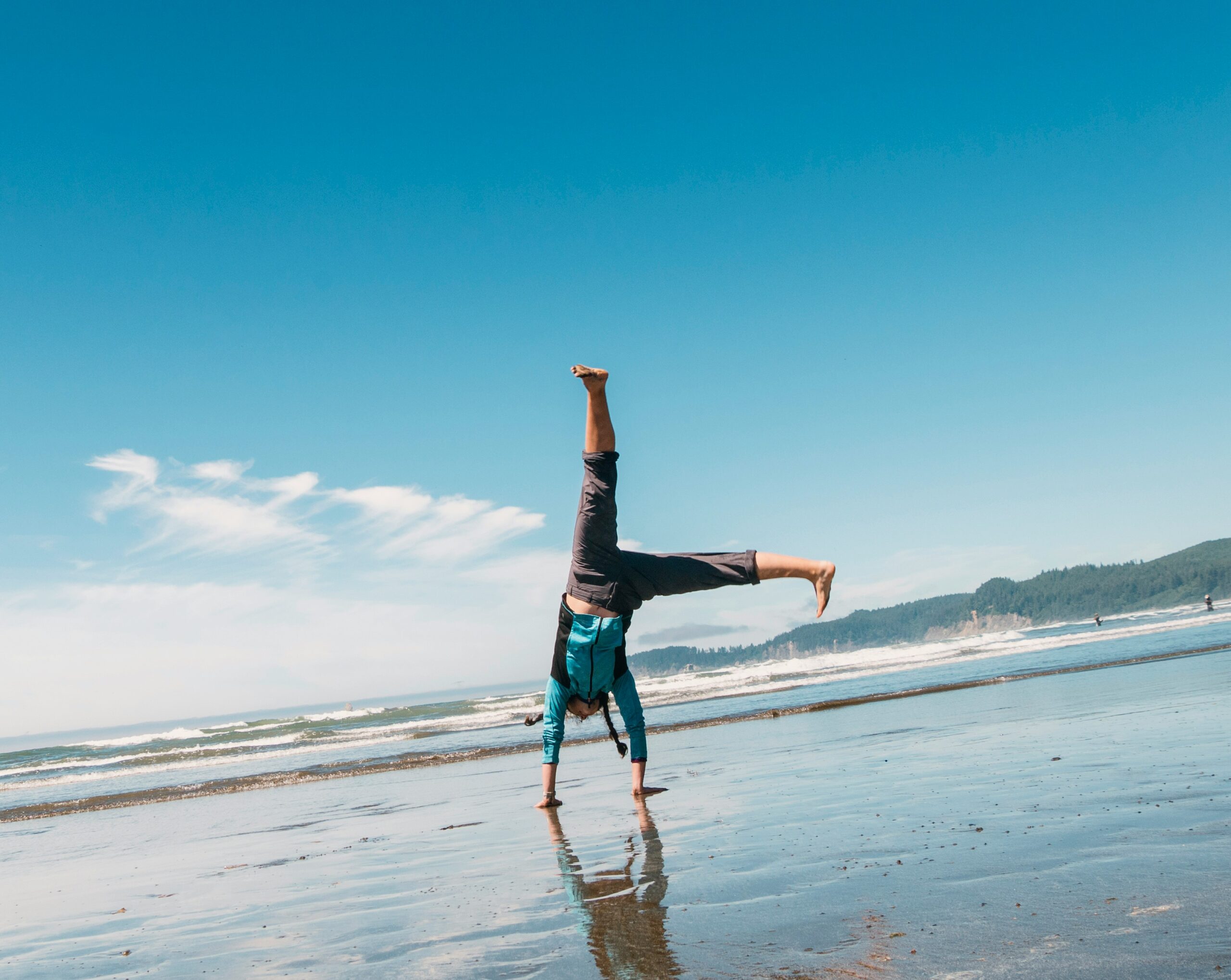 man doing a stunt on beach